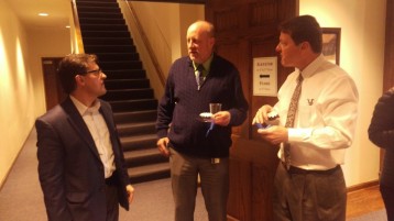 Dr. Mark Hanshaw (left) greets Dr. Steven Daniell and President Frederick Slabach at his goodbye party. Photo by Hannah Onder